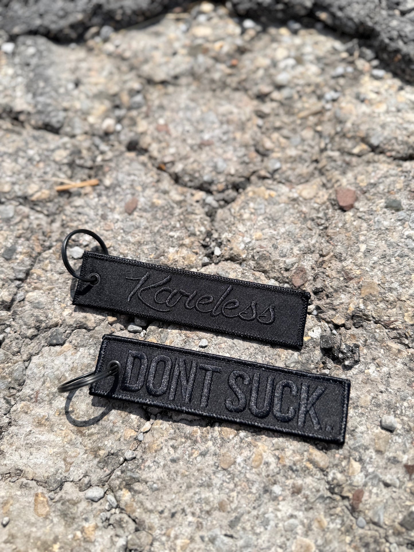 'DONT SUCK.' Black-on-Black Key Tag