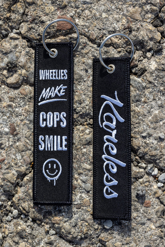 Wheelies Make Cops Smile Key Tag